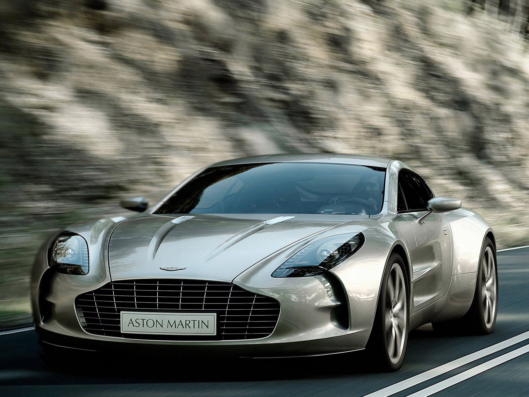 Скачать aston martin, one-77, 2009, серый металлик, вид спереди, стиль, астон мартин, скорость обои на рабочий стол