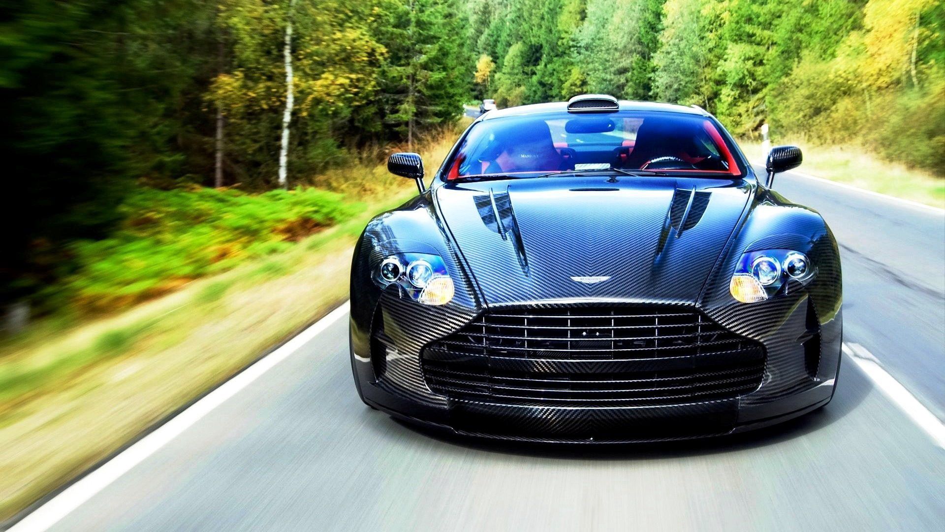 Скачать aston martin, vanquish, 2015, вид спереди, движение обои на рабочий стол