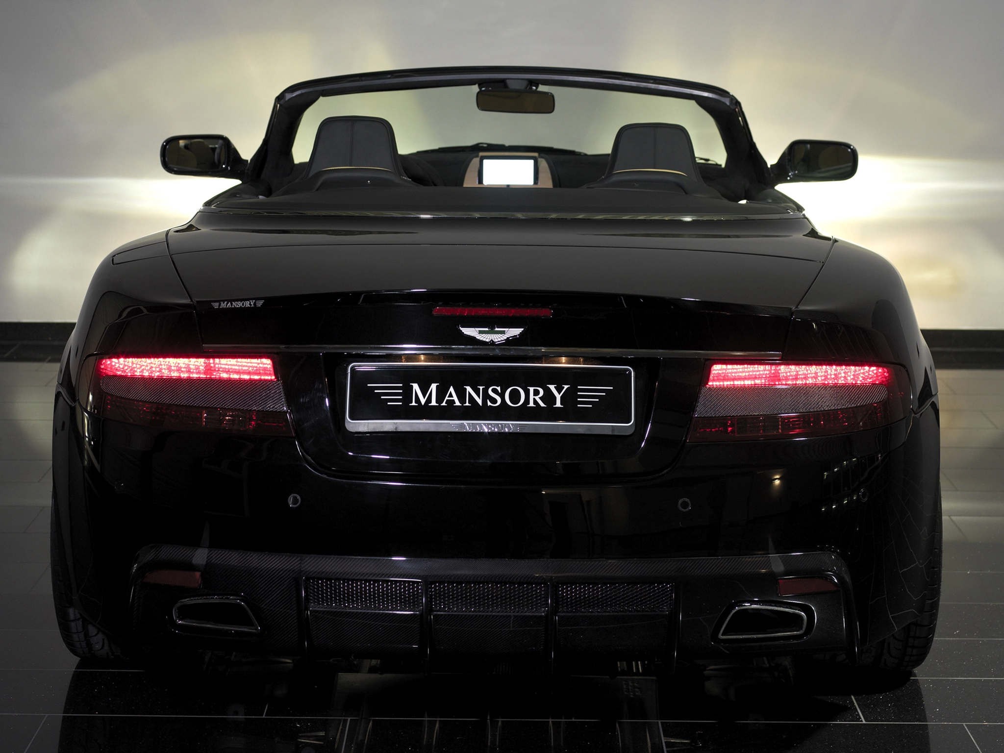 Скачать mansory, aston martin, db9, 2008, черный, вид сзади, стиль, авто обои на рабочий стол