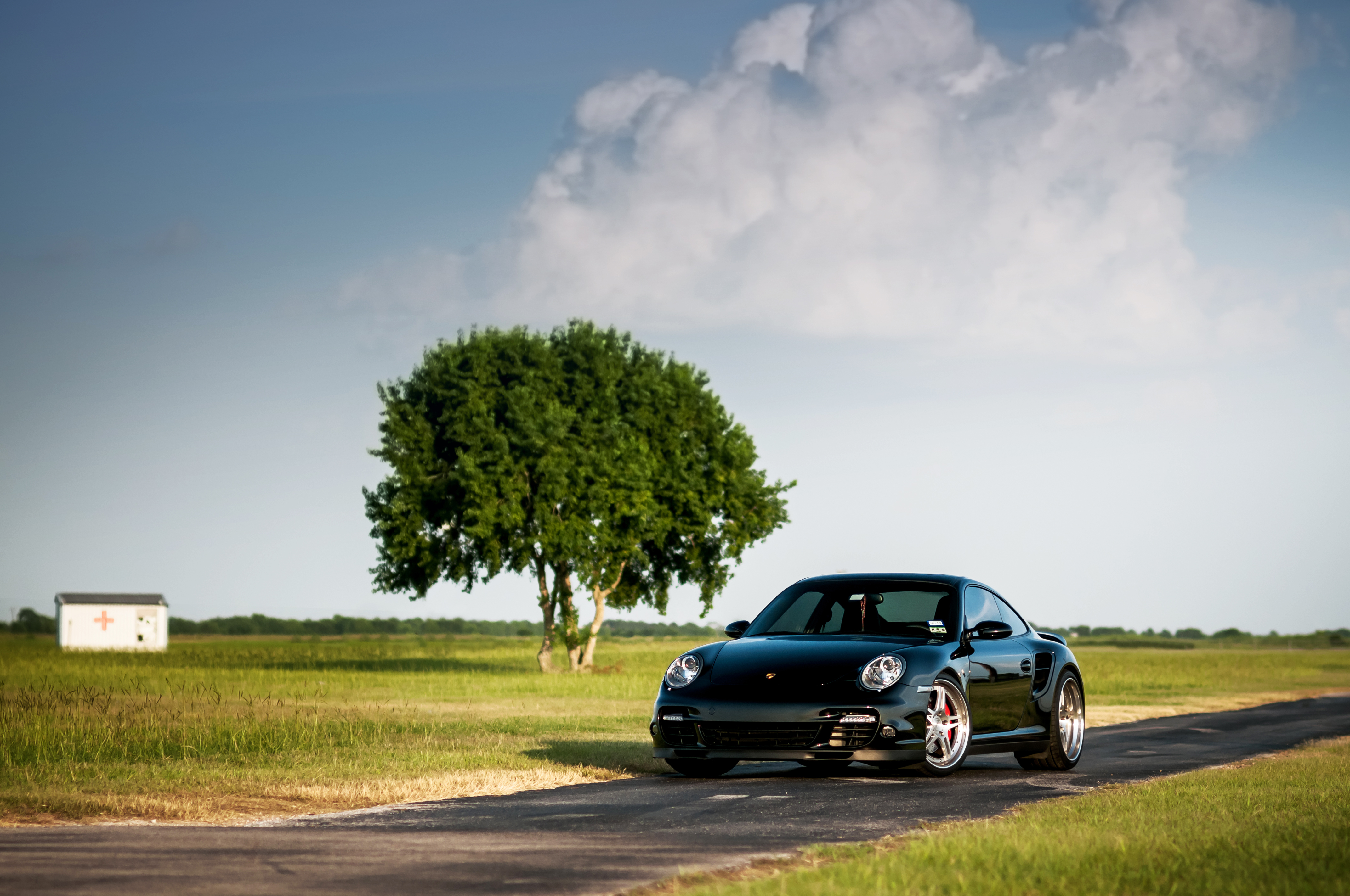 Скачать porsche, 911, turbo, 997, black, front, порше, чёрный, дерево, небо обои на рабочий стол